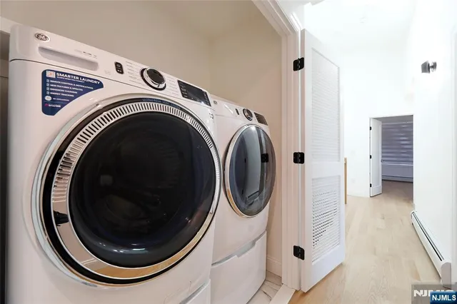 a view of a house with backyard and a tree