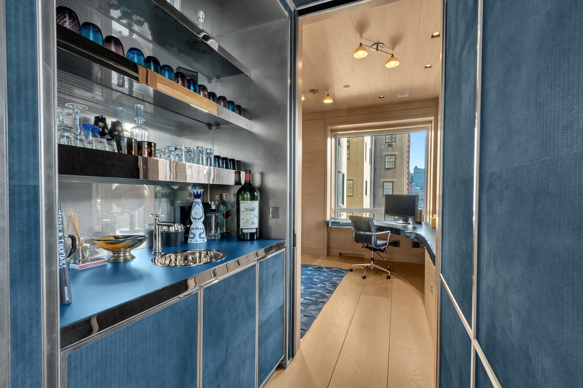730 Park Avenue, Unit 10C/11C Manhattan, NY 10021 - Photo 10 of 27 a kitchen with a refrigerator and wooden floor