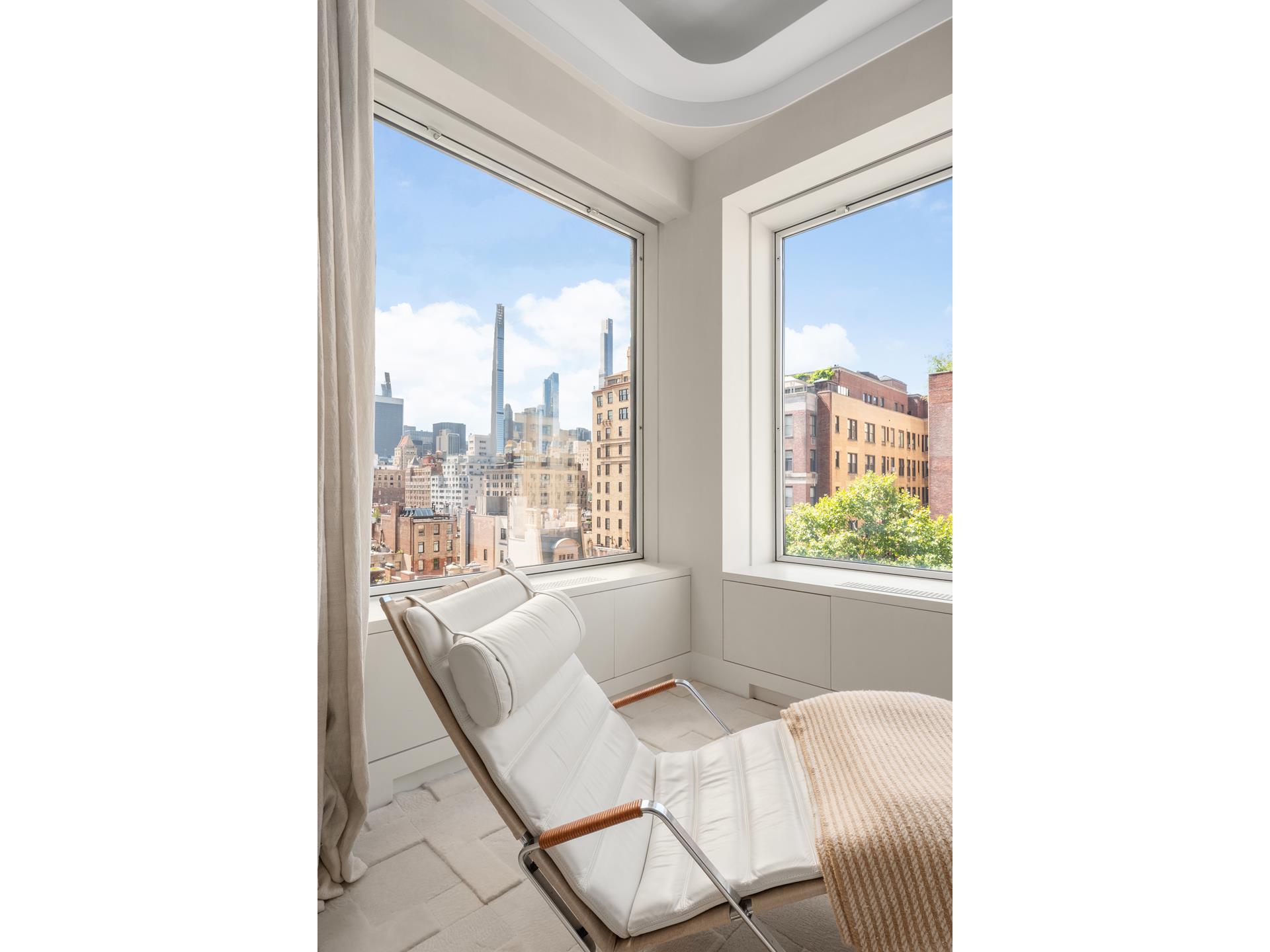 730 Park Avenue, Unit 10C/11C Manhattan, NY 10021 - Photo 13 of 27 a dining room with furniture and a window