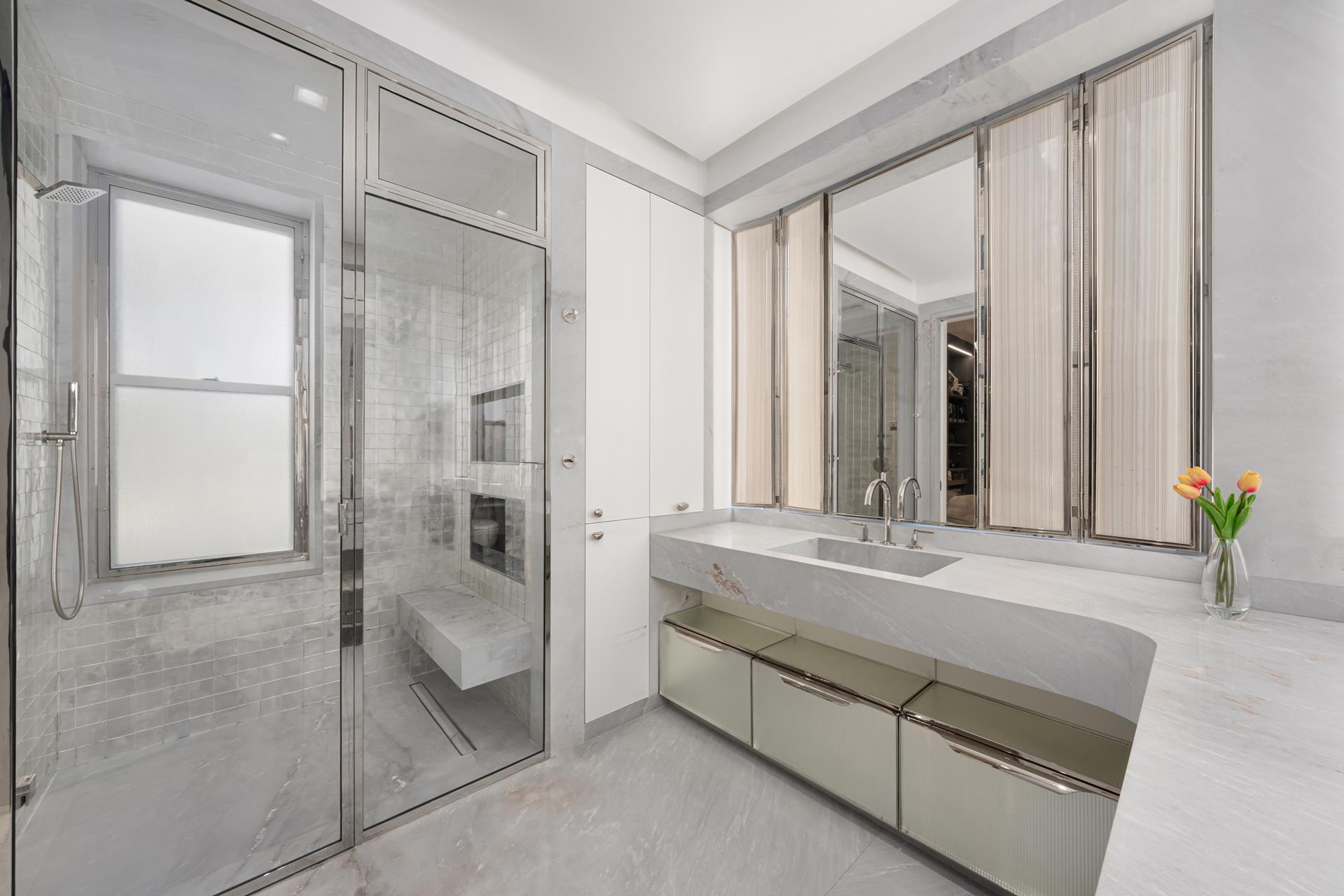 730 Park Avenue, Unit 10C/11C Manhattan, NY 10021 - Photo 15 of 27 a spacious bathroom with a shower and a sink
