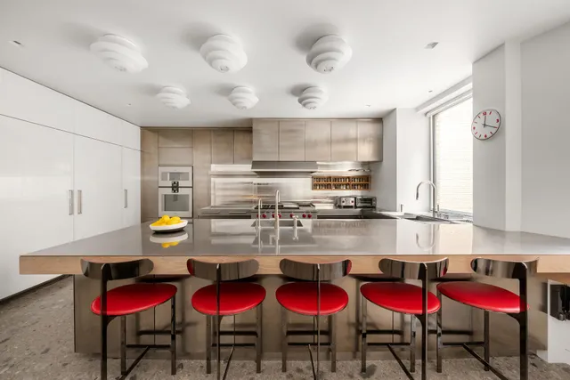a view of a refrigerator in kitchen and wooden floor