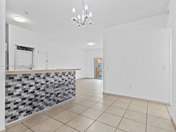 a kitchen with a sink and a stove