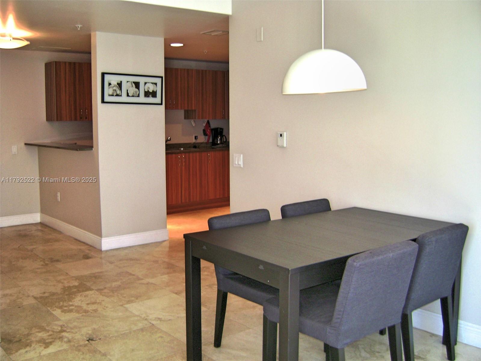 6305 Indian Creek Drive, Unit 3F Miami Beach, FL 33141 - Photo 23 of 60 a view of kitchen island with cabinets and wooden floor