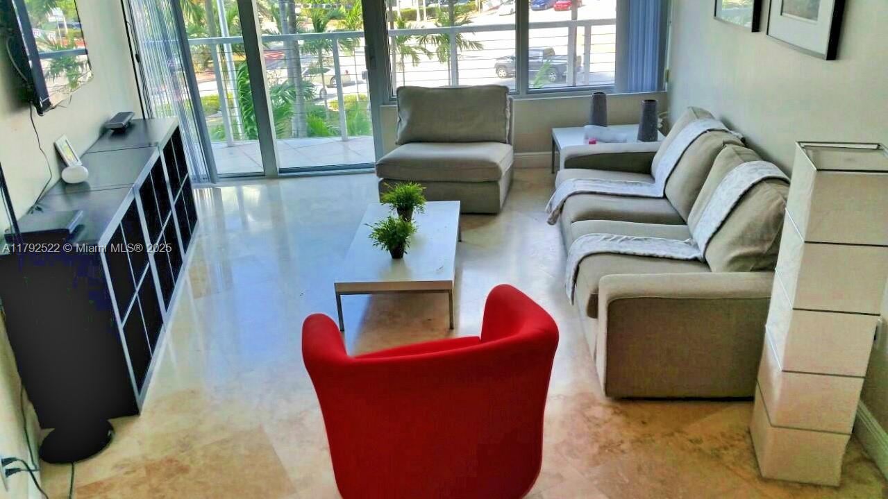6305 Indian Creek Drive, Unit 3F Miami Beach, FL 33141 - Photo 25 of 60 a living room with furniture and a window