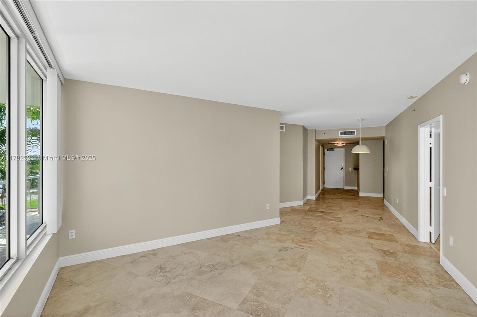 6305 Indian Creek Drive, Unit 3F Miami Beach, FL 33141 - Photo 28 of 60 an empty room with a natural light