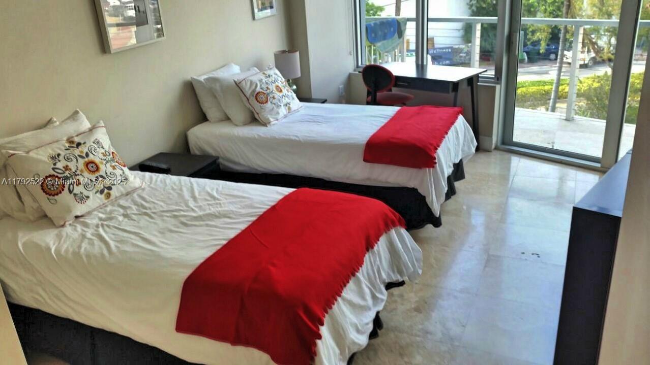 6305 Indian Creek Drive, Unit 3F Miami Beach, FL 33141 - Photo 32 of 60 a bedroom with a bed and window