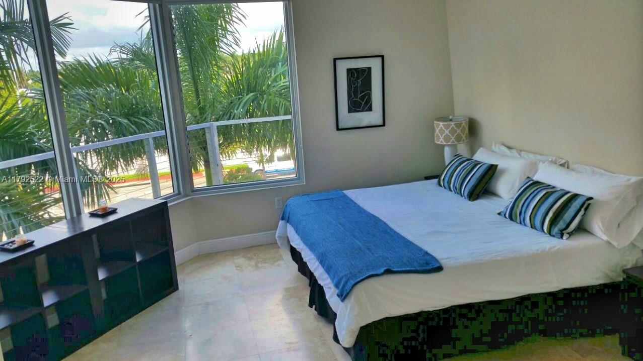 6305 Indian Creek Drive, Unit 3F Miami Beach, FL 33141 - Photo 43 of 60 a bedroom with a bed and window