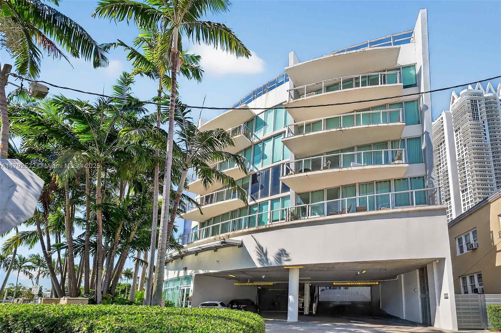 6305 Indian Creek Drive, Unit 3F Miami Beach, FL 33141 - Photo 8 of 60 a view of a palm trees in front of a building