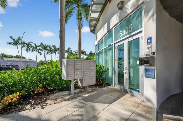 a view of a livingroom with furniture and a flat screen tv