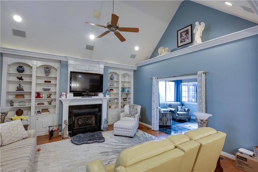 7925 Old Salisbury Road Linwood, NC 27299 - Photo 11 of 31 Built in bookcases, cathedral ceiling & gas log fireplace