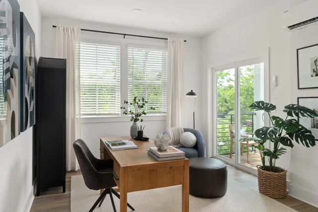 a view of a dining room with furniture window and outside view