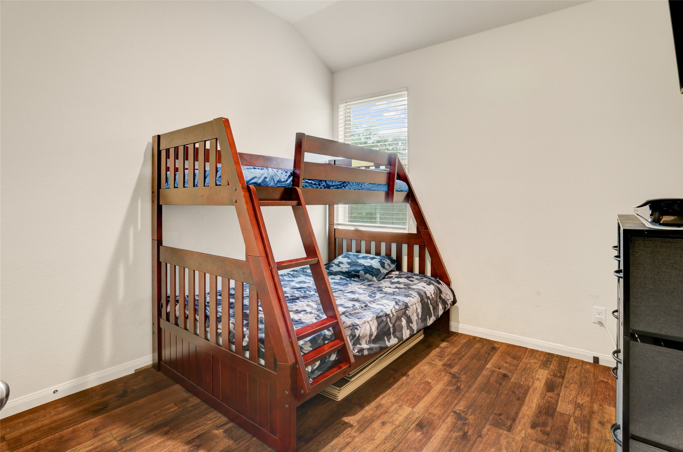 6535 Blimp Base Road Hitchcock, TX 77563 - Photo 20 of 36 The first of the two secondary bedrooms. This bedroom is located away from the primary bedroom--perfect for owner privacy.