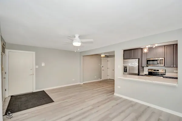 a view of a kitchen with a sink and cabinets