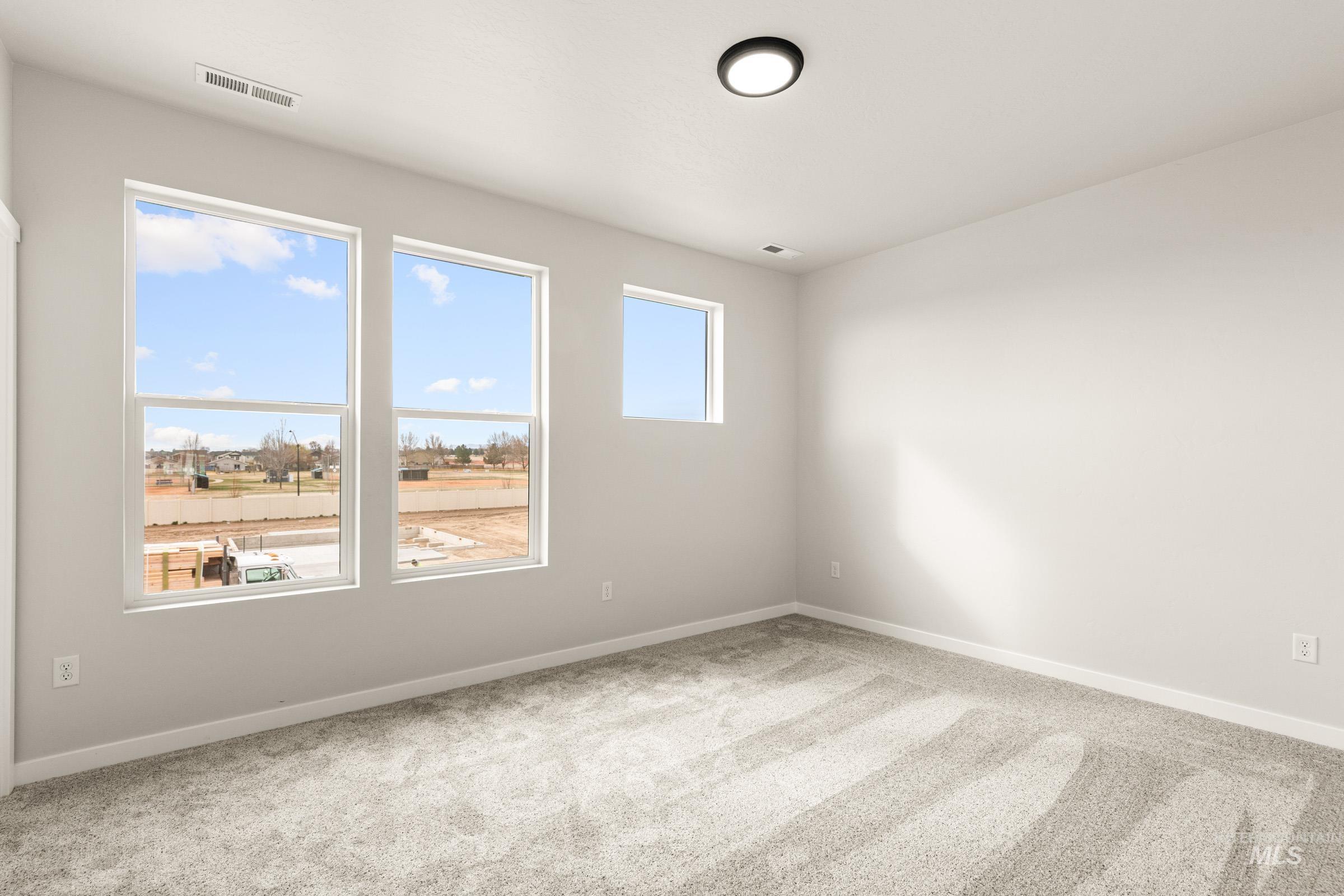 13688 Redway Court Caldwell, ID 83607 - Photo 23 of 26 Empty room with light colored carpet and baseboards