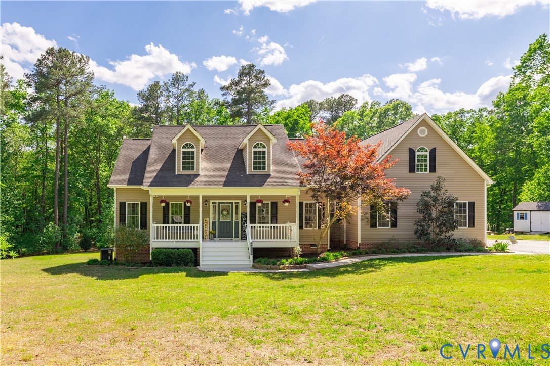 4789 Tatum Road Disputanta, VA 23842 - Photo 1 of 46 a front view of a house with a yard
