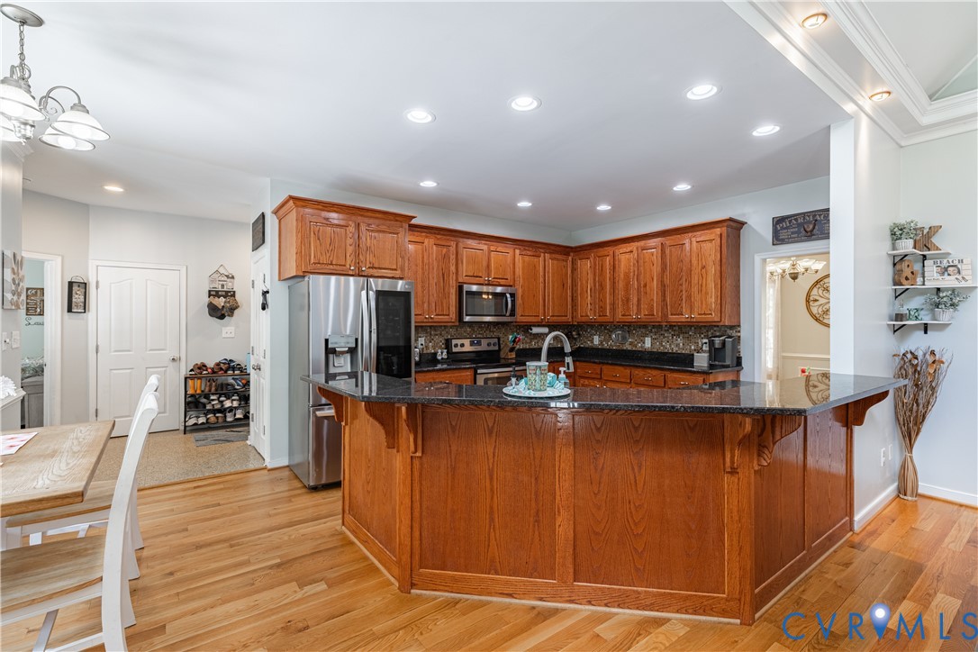 4789 Tatum Road Disputanta, VA 23842 - Photo 13 of 46 a large kitchen with stainless steel appliances lots of counter space and furniture