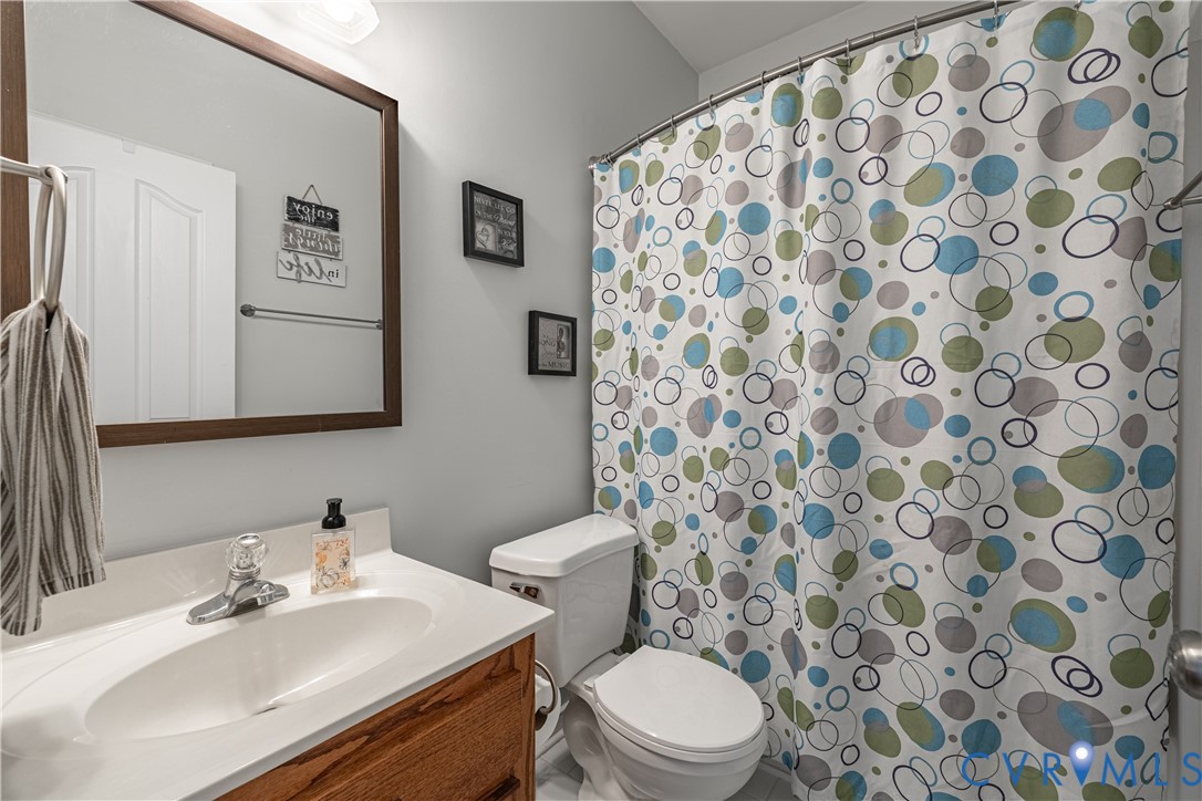 4789 Tatum Road Disputanta, VA 23842 - Photo 20 of 46 a bathroom with a sink and a mirror
