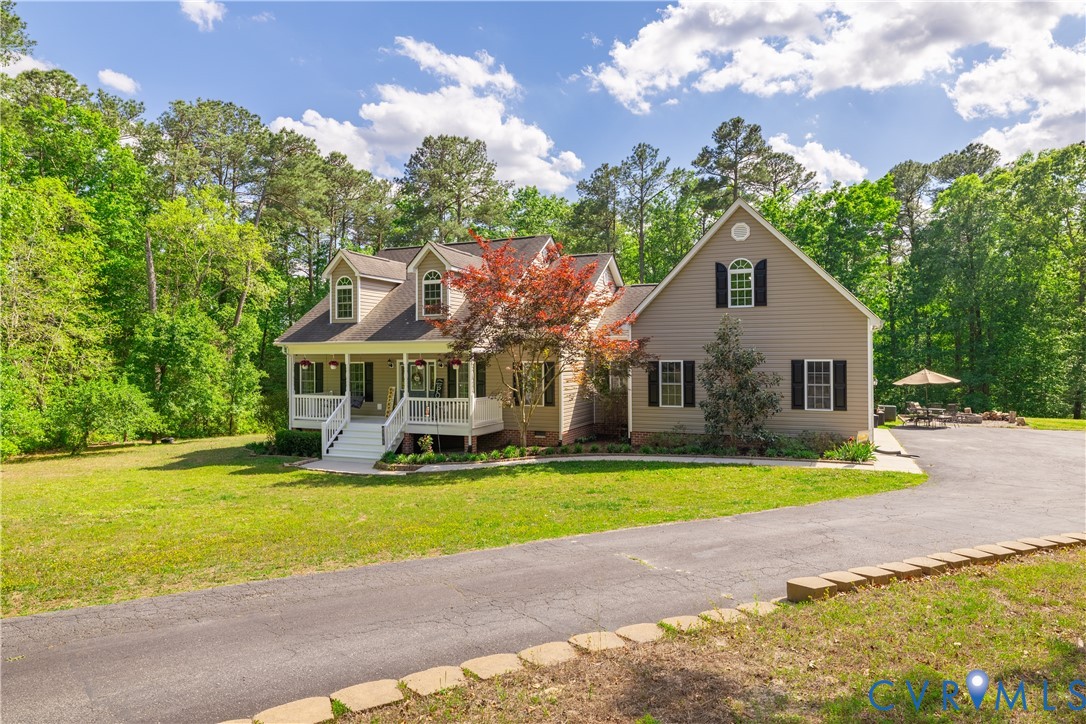 4789 Tatum Road Disputanta, VA 23842 - Photo 2 of 46 a front view of a house with garden