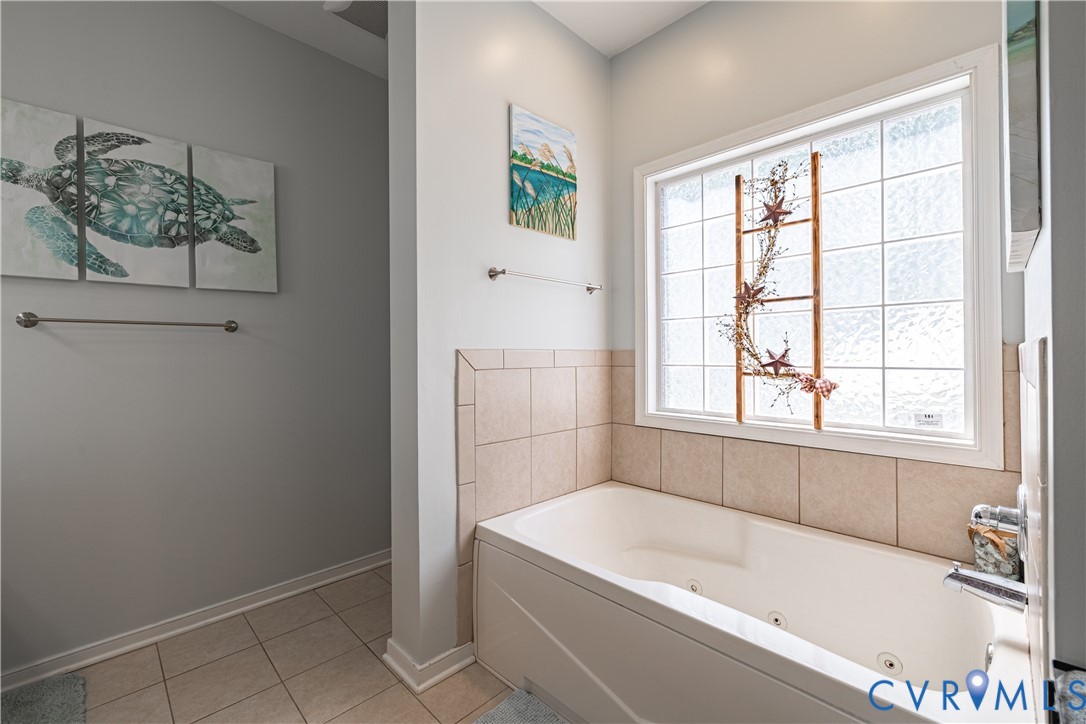 4789 Tatum Road Disputanta, VA 23842 - Photo 26 of 46 a white bath tub sitting next to a window