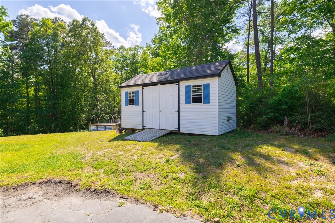 4789 Tatum Road Disputanta, VA 23842 - Photo 37 of 46 a house view with a swimming pool