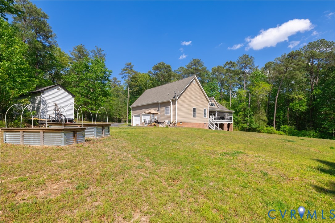 4789 Tatum Road Disputanta, VA 23842 - Photo 39 of 46 a view of house with outdoor space and trees in the background
