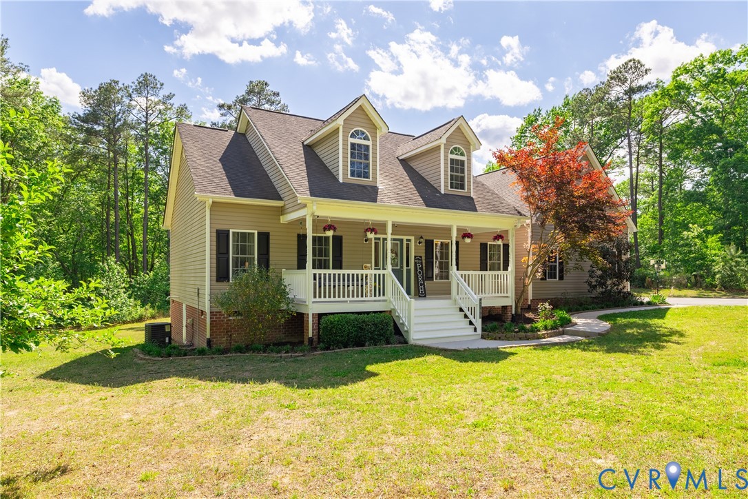 4789 Tatum Road Disputanta, VA 23842 - Photo 43 of 46 a front view of house with yard and trees