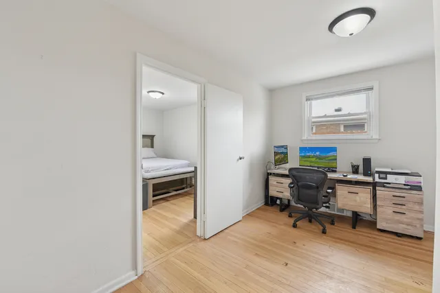 a workspace with furniture and wooden floor