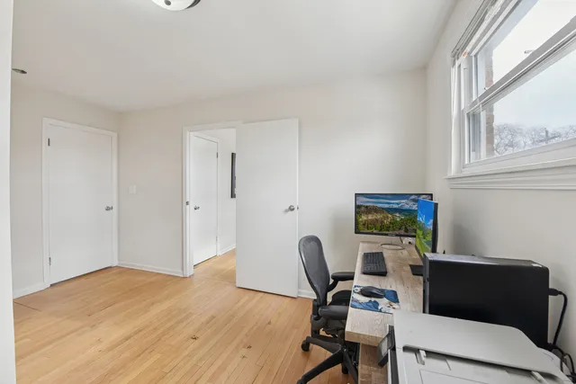 a workspace with furniture and a window