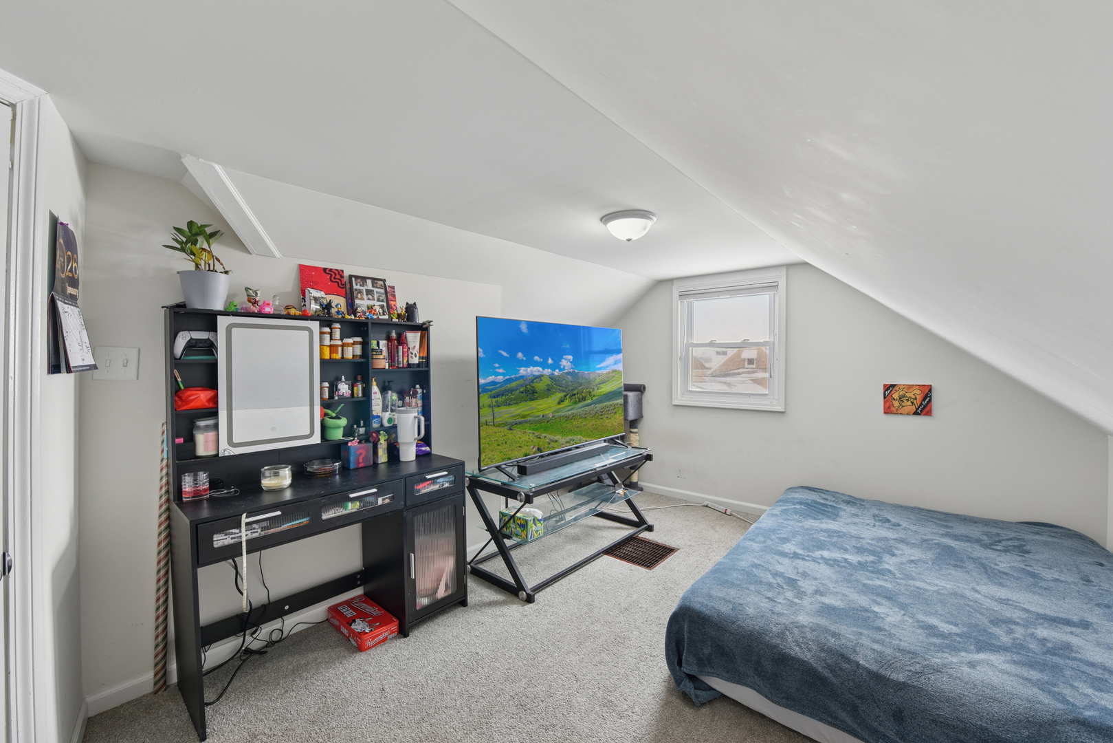 4137 Ruby Street Schiller Park, IL 60176 - Photo 17 of 24 a bedroom with bed and a flat tv screen on dresser