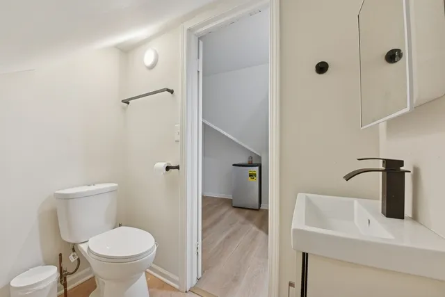 a bathroom with a toilet and a sink