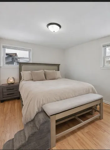 a bedroom with a bed and a night stand