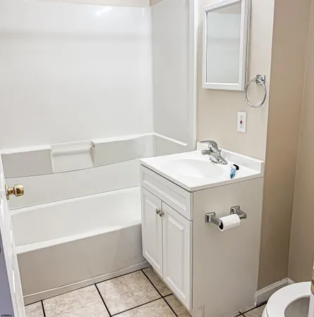 a bathroom with a sink a vanity and a mirror