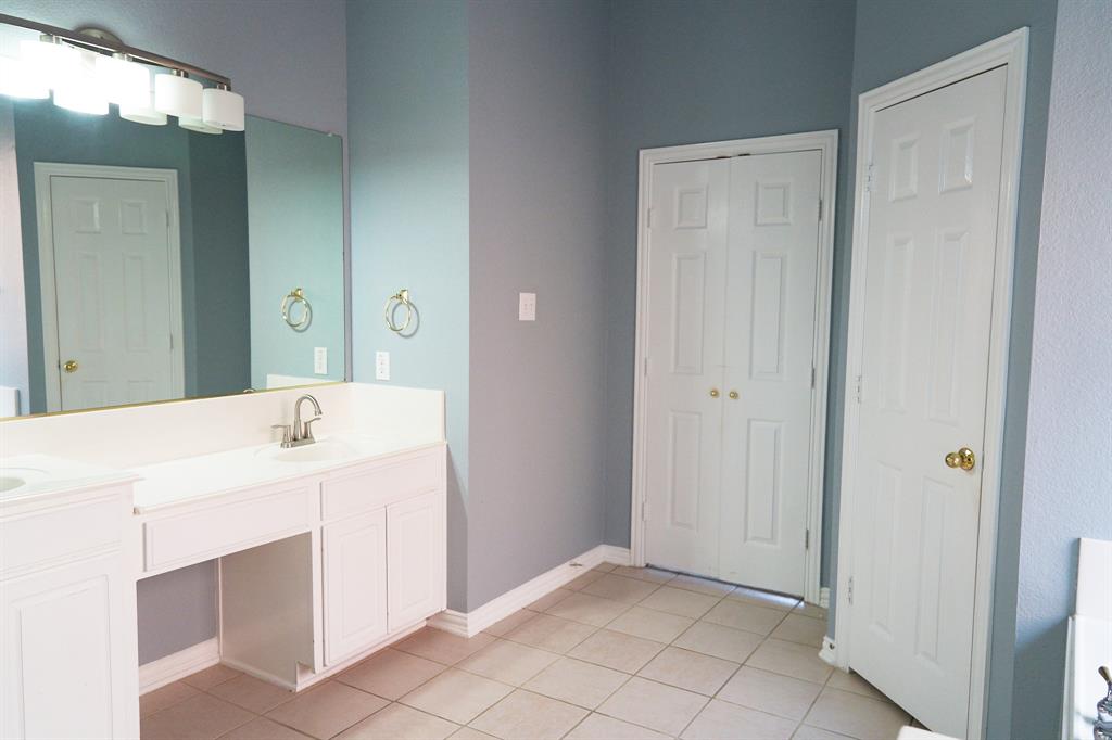 4469 Big Sky Drive Plano, TX 75024 - Photo 20 of 39 a room with a sink and a mirror