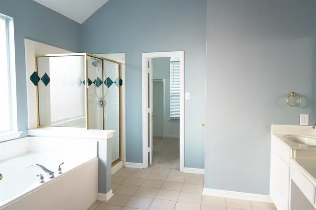 a bathroom with a bathtub and a sink