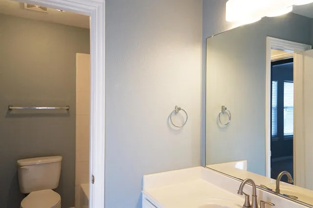 a bathroom with a toilet and a sink