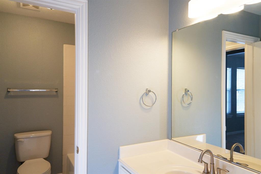 4469 Big Sky Drive Plano, TX 75024 - Photo 34 of 39 a bathroom with a toilet and a sink