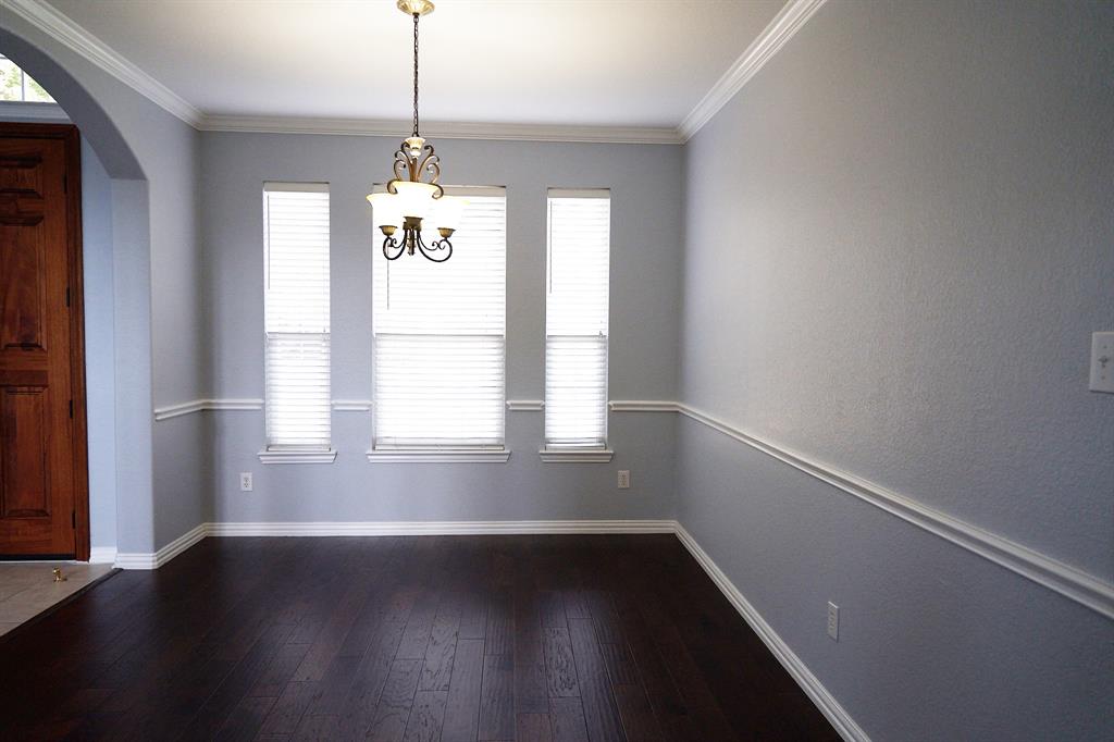 4469 Big Sky Drive Plano, TX 75024 - Photo 6 of 39 a room with wooden floor and windows