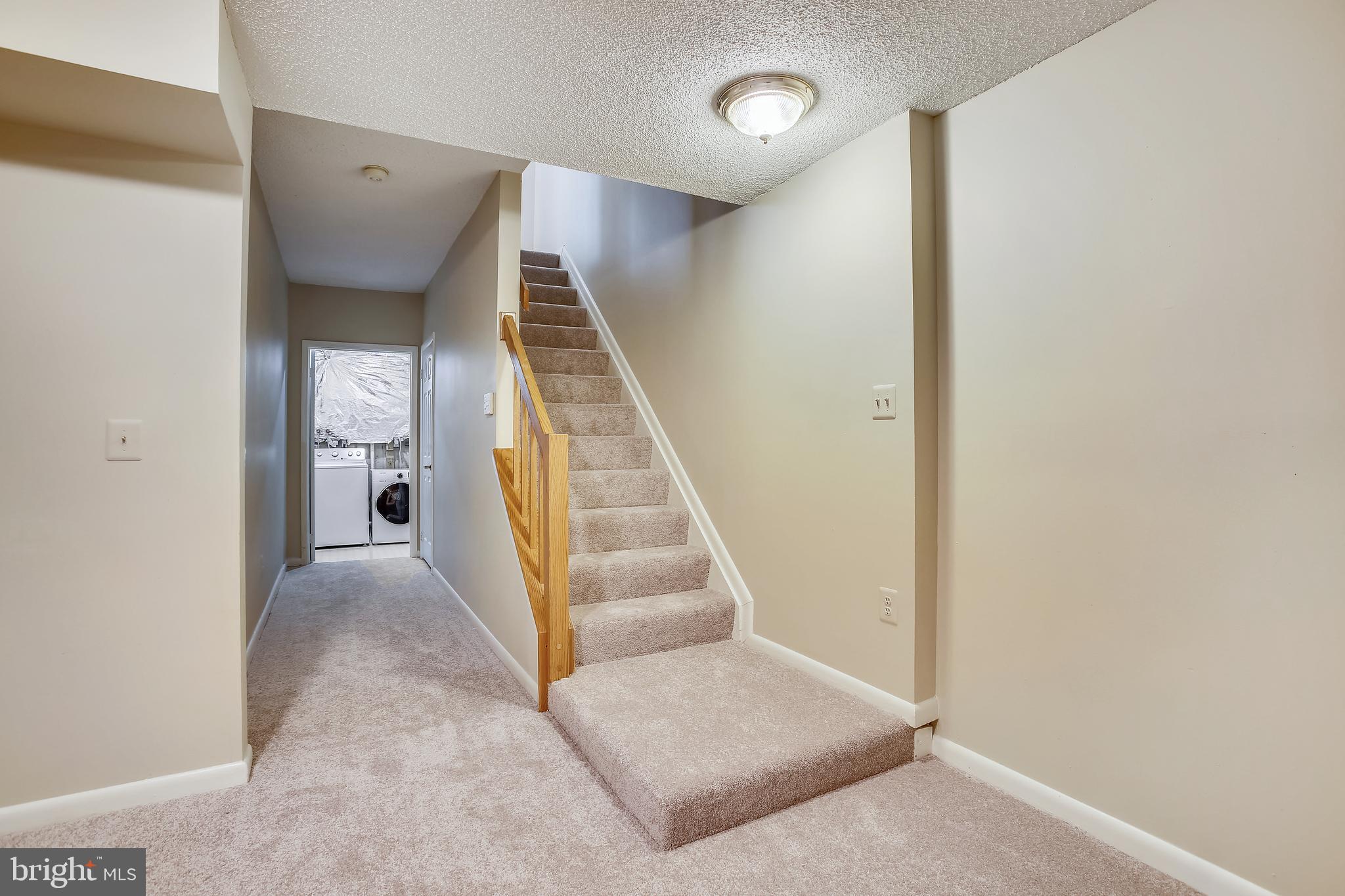 1404 Newport Spring Court Reston, VA 20194 - Photo 50 of 70 Lower Level Hallway to Laundry Room and Half Bath