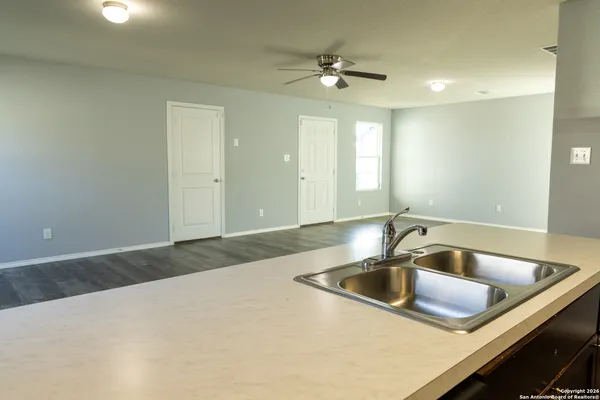 a kitchen with a sink and natural light