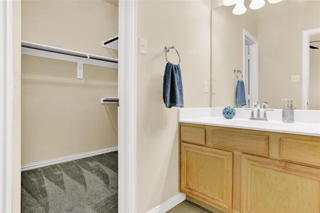 a bathroom with a sink and mirror