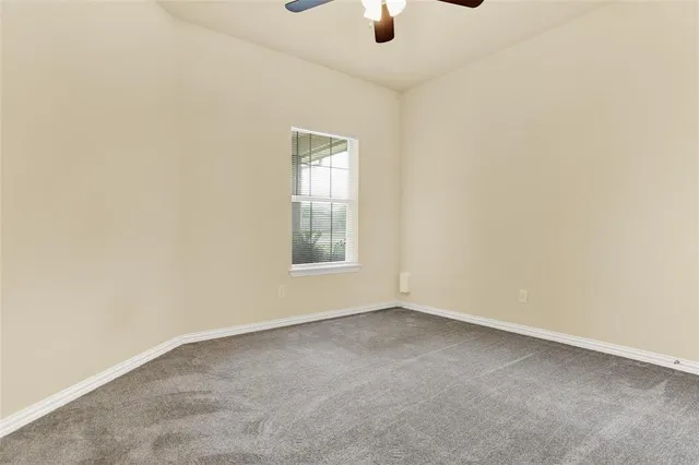 an empty room with a empty space and a window