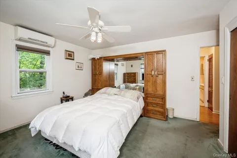 a bed room with a bed and a chandelier