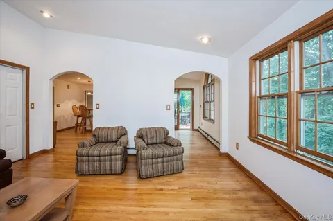 a living room with furniture rug and window