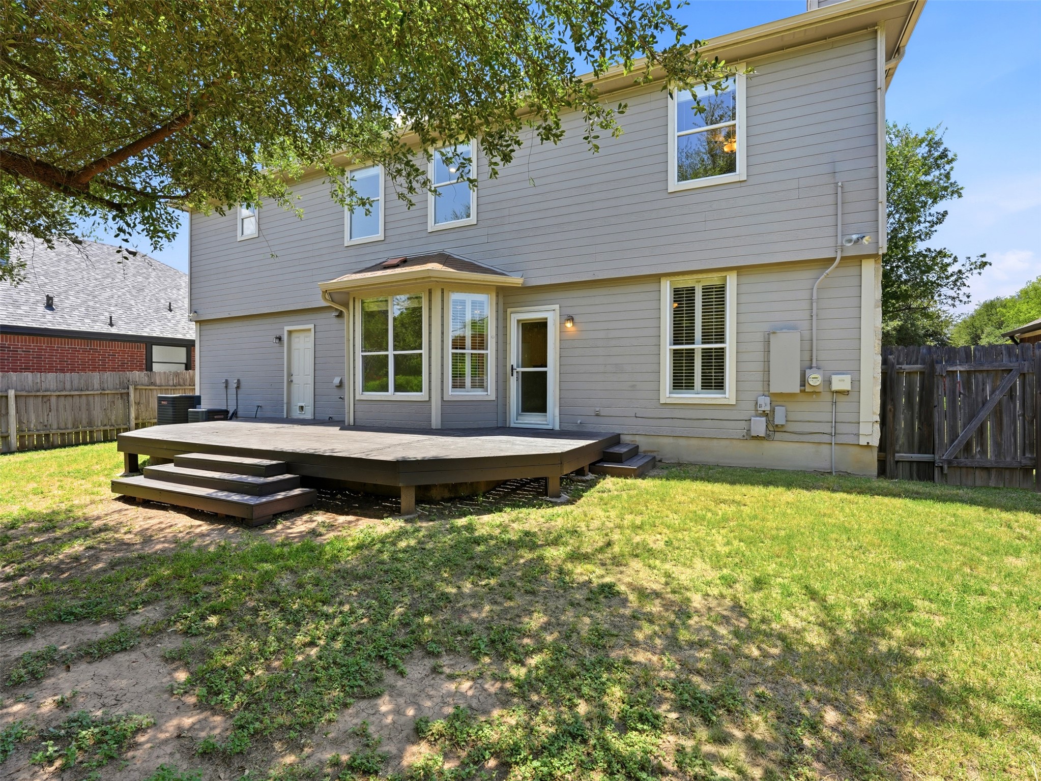 15207 Natural Spring Way Austin, TX 78728 - Photo 32 of 40 Your living space extends outdoors onto the elevated back deck where you can configure outdoor living and dining spaces with a view.