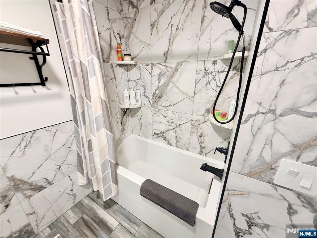 33 Willow Wood Court, Unit 2 East Rutherford, NJ 07073 - Photo 13 of 17 a bathroom with a bathtub and shower