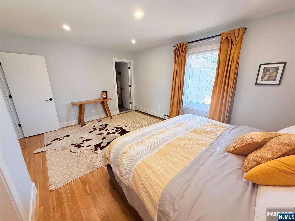 33 Willow Wood Court, Unit 2 East Rutherford, NJ 07073 - Photo 15 of 17 a bedroom with a bed and a window