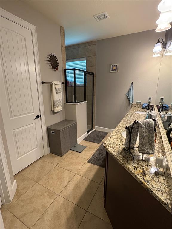 709 Calabria Way Howey-in-the-Hills, FL 34737 - Photo 12 of 26 a bedroom with a bed and a mirror