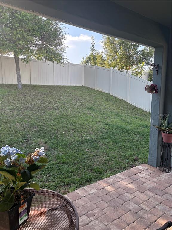 709 Calabria Way Howey-in-the-Hills, FL 34737 - Photo 20 of 26 a view of a backyard