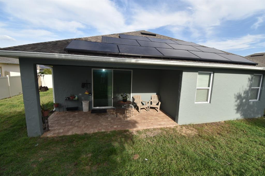 709 Calabria Way Howey-in-the-Hills, FL 34737 - Photo 22 of 26 a front view of a house with garden