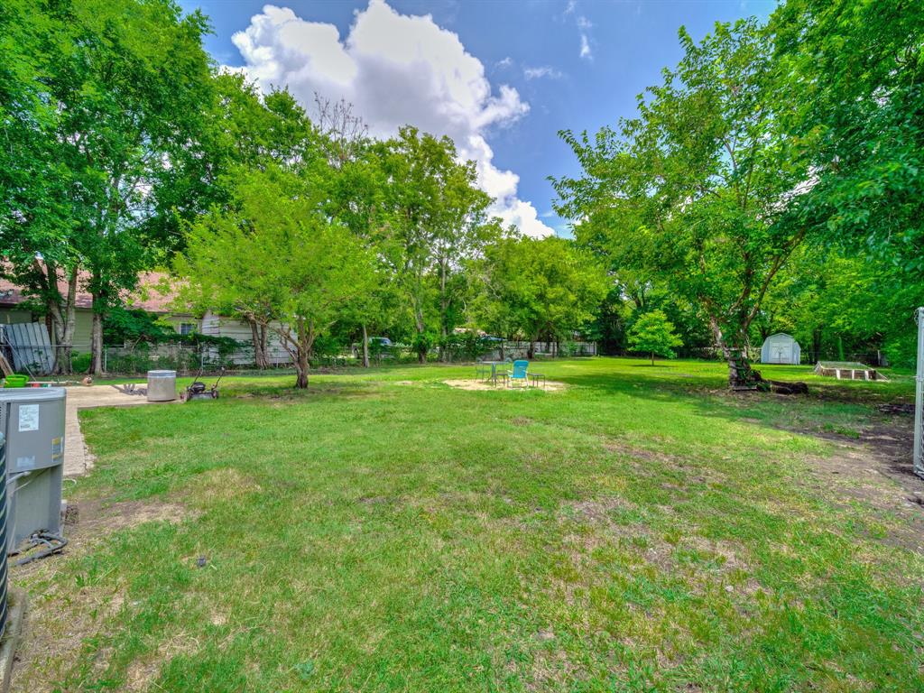 13833 Indian Wells Road Dallas, TX 75253 - Photo 38 of 39 View of large fenced back yard with a storage shed
